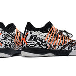 Chuteira Futsal Puma Future Z 1.3 IC Preto, Branco e Laranja "Teaser"